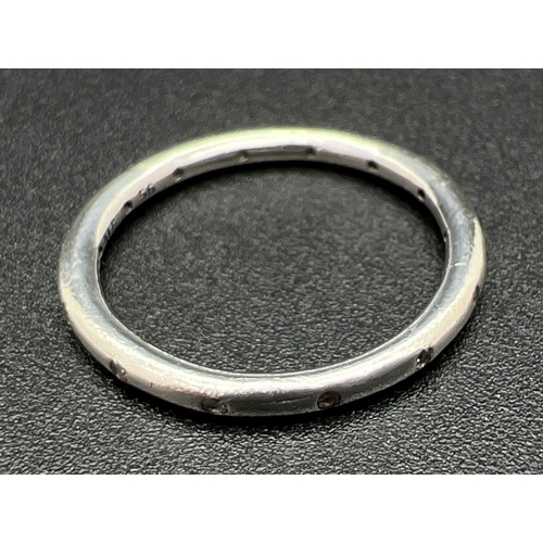 1107 - A boxed silver 'Simply Sparkling' band ring by Pandora. Marked inside of band S925 Ale 56. Size N½ o... 