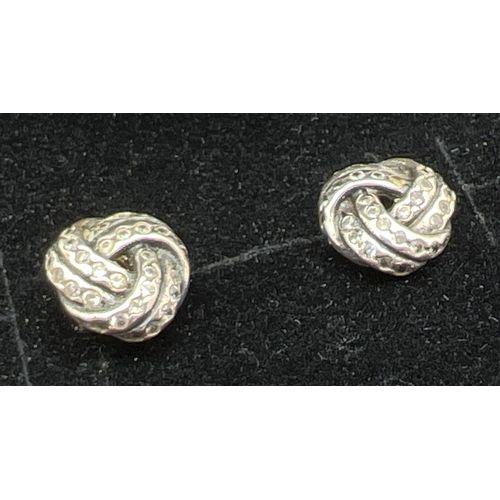 1108 - A boxed pair of silver Sparkling Love Knot stud style earrings by Pandora, set with small round cut ... 