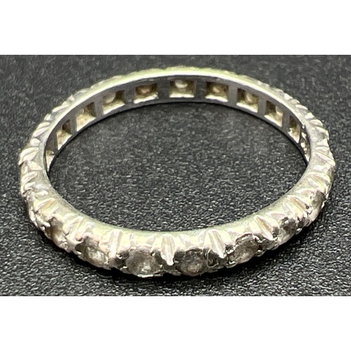 1109 - A vintage 9ct white gold full eternity ring set with small round cut clear stones. Gold mark inside ... 