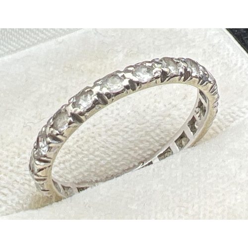 1109 - A vintage 9ct white gold full eternity ring set with small round cut clear stones. Gold mark inside ... 