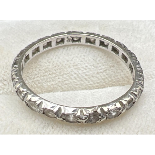 1109 - A vintage 9ct white gold full eternity ring set with small round cut clear stones. Gold mark inside ... 