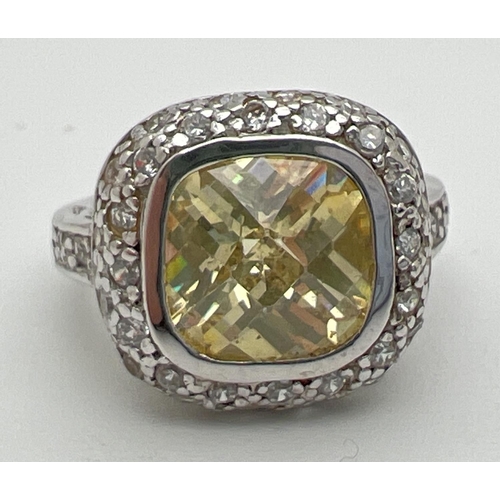 1112 - A silver, lemon quartz and cubic zirconia cocktail ring with central cushion cut stone. Surrounded b... 