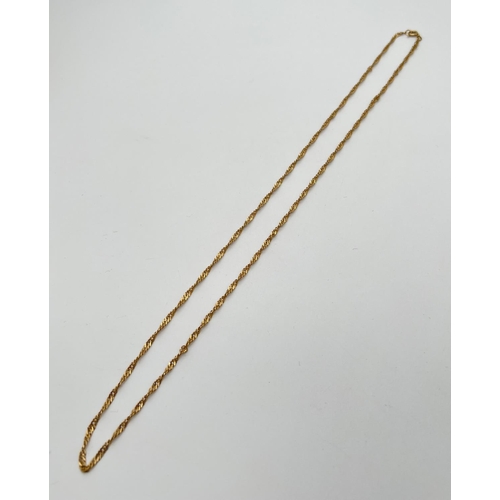 1125 - A 28 inch 18ct gold Singapore style chain necklace with Spring ring clasp. Worn marks to clasp. Tota... 