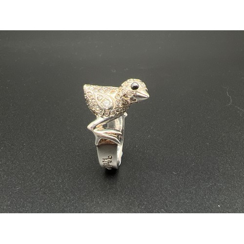 1151 - A 925 silver Chick ring by Vivienne Westwood. Silver band with chick to top set with clear and black... 