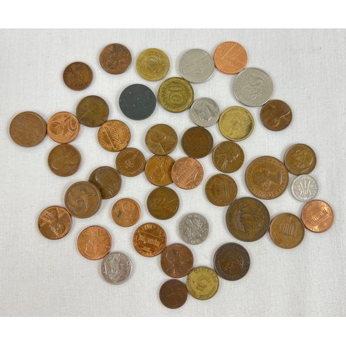 51 - A small collection of foreign and British coins. To include examples from America, Australia, Pakist... 