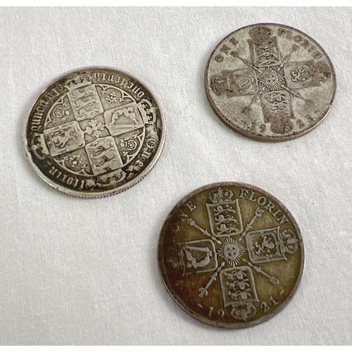 1 - 3 antique florin coins. A Queen Victoria Gothic silver florin together with 2 George V Florins - 192... 