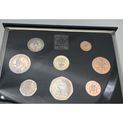 13 - A cased set of 1984 Elizabeth II proof coins by Royal Mint. To include the Scottish £1 coin. Complet... 