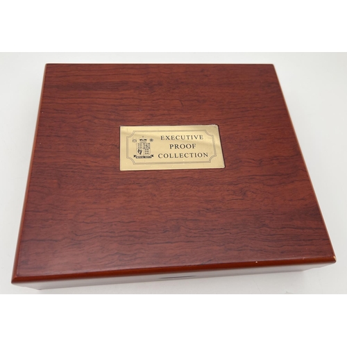 15 - A cased set of 2006 Royal Mint Executive Proof Collection coins in a wooden presentation box. To inc... 