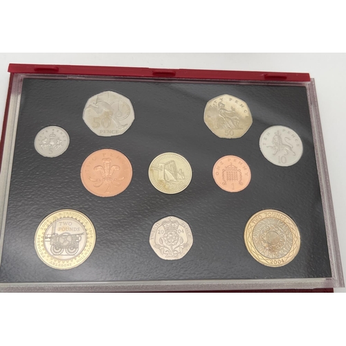 16 - A cased set of Royal Mint 2004 proof coins with information booklet. To include 200 yrs of the steam... 