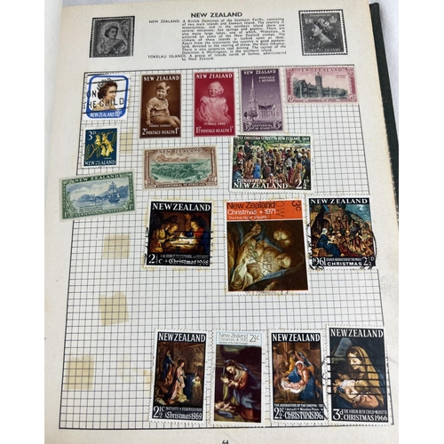 63 - A green The Everest Illustrated Stamp Album containing British and world stamps. Together with a col... 