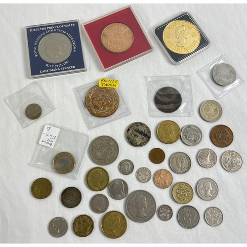 20 - A collection of vintage British and foreign coins and medallions. To include an 1875 Victoria penny,... 