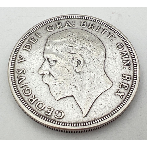 24 - A .500 silver 1931 George V crown with crown and wreath detail to reverse.
