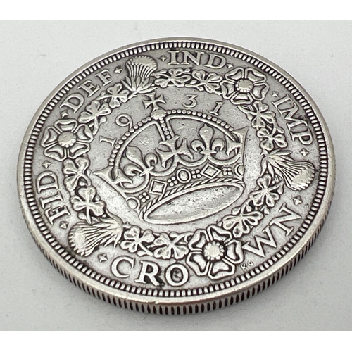 24 - A .500 silver 1931 George V crown with crown and wreath detail to reverse.