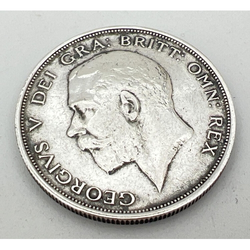 25 - A 1911 George V silver half crown coin with crown and coat of arms to reverse.
