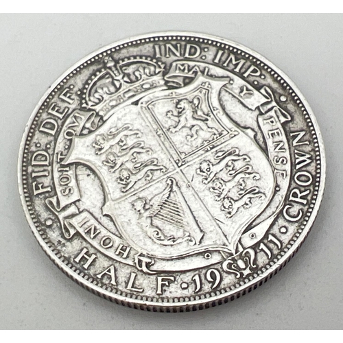 25 - A 1911 George V silver half crown coin with crown and coat of arms to reverse.