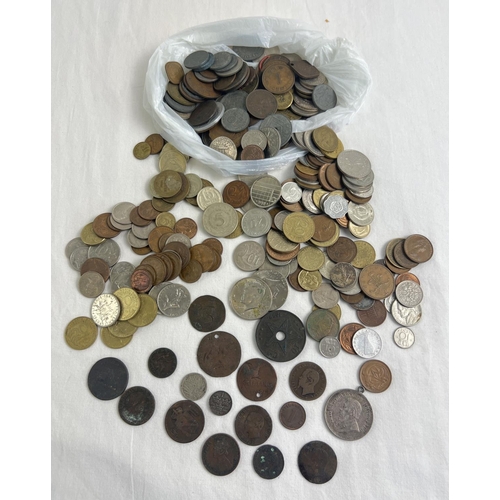 29 - A collection of antique and vintage foreign and British territories coins. To include Victoria Anna ... 