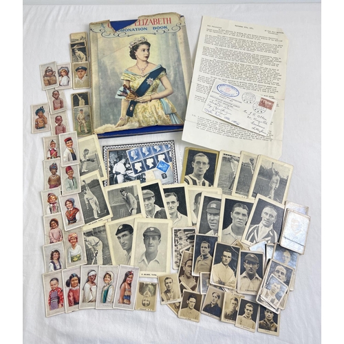 114 - A small collection of mixed ephemera. To include vintage real photo collectors cards of cricketers a... 