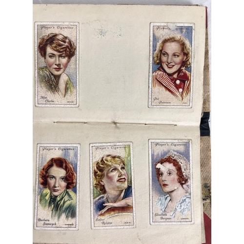 115 - 3 vintage cigarette card albums containing vintage card sets and parts sets together with a bag of l... 