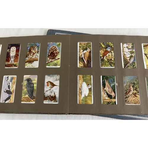 115 - 3 vintage cigarette card albums containing vintage card sets and parts sets together with a bag of l... 