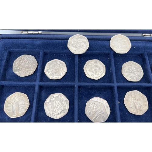 36 - A collection of 14 collectors 50p coins together with a Westminster coin collectors case with 2 lift... 