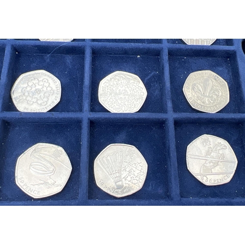 36 - A collection of 14 collectors 50p coins together with a Westminster coin collectors case with 2 lift... 