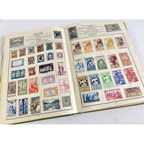 89 - A vintage Globe Trotter Stamp album of assorted world stamps to include franked & unfranked examples... 