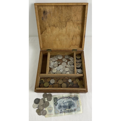 48 - A vintage wooden box of assorted foreign coins and a Bulgarian banknote. To include currency from Fr... 