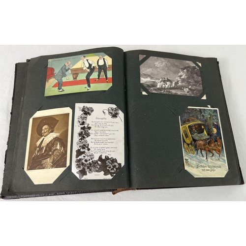 239 - An Art Nouveau postcard album containing approx. 175 assorted postcards. To include animals, street ... 