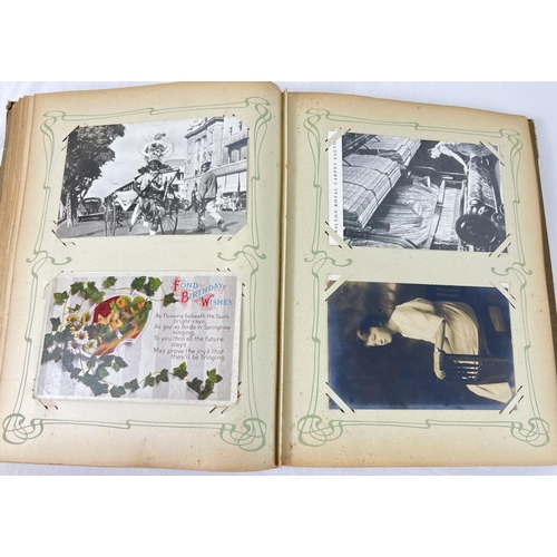 242 - An Art Nouveau postcard album containing 160+ assorted British & overseas postcards and greetings ca... 