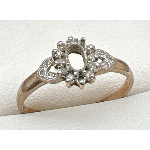 1080 - A 9ct gold vintage dress ring set with small round cut diamonds. Central stone missing and one small... 