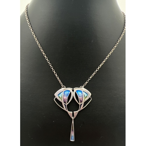 1002 - A silver Art Nouveau style fixed pendant necklace. A floral design central pendant with triangular d... 