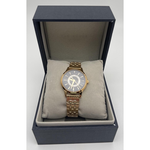 1153 - A boxed Ted Baker Fitzrovia Charm wristwatch, complete with tags, protective plastic coverings and i... 