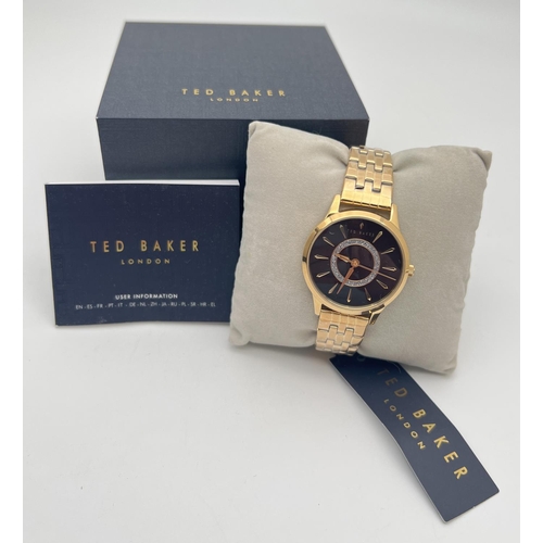 1153 - A boxed Ted Baker Fitzrovia Charm wristwatch, complete with tags, protective plastic coverings and i... 