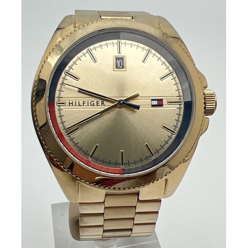 1156 - A men's wristwatch by Tommy Hilfiger - TH 397.1.34.2863. Gold tone stainless steel strap, case and f... 