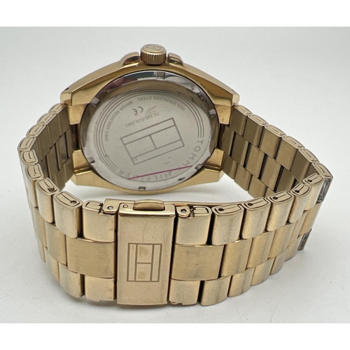 1156 - A men's wristwatch by Tommy Hilfiger - TH 397.1.34.2863. Gold tone stainless steel strap, case and f... 