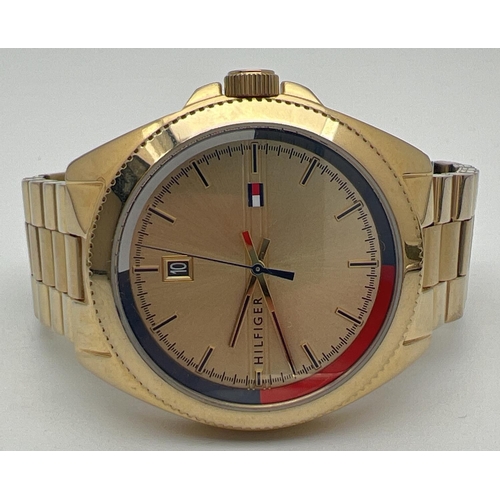 1156 - A men's wristwatch by Tommy Hilfiger - TH 397.1.34.2863. Gold tone stainless steel strap, case and f... 