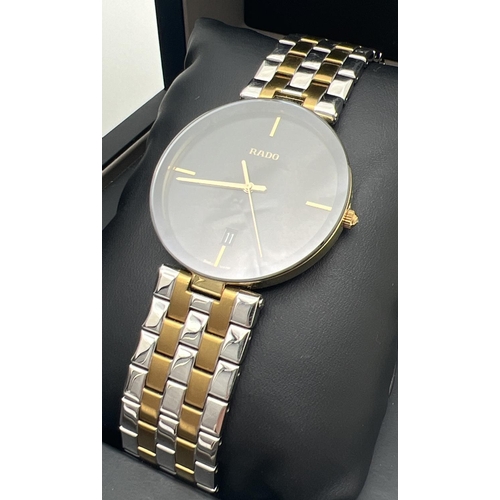 1157 - A boxed men's Rado Florence quartz wristwatch 15448866. Gold and silver tone stainless steel strap a... 