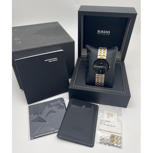 1157 - A boxed men's Rado Florence quartz wristwatch 15448866. Gold and silver tone stainless steel strap a... 