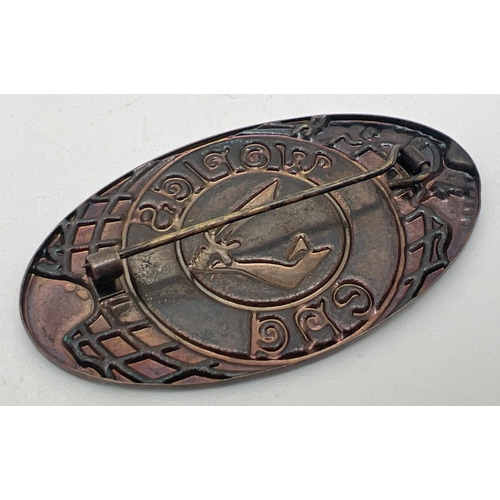 1032 - An oval bronze coloured metal 