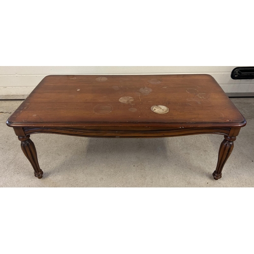 1417 - A large modern coffee table with channelled legs of classical design. Water marks to top. Approx. 45... 