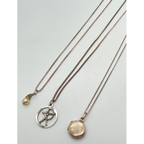 1055 - 3 silver & white metal pendant necklaces. A 925 silver small circular locket on an 18