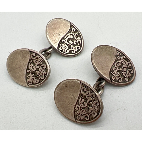 1057 - A pair of late Victorian Charles Horner silver cufflinks with half engraved oval panels of scroll & ... 