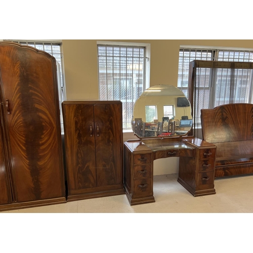 1429 - A vintage 1940's walnut veneer 4 piece bedroom suite with shaped handles of channelled design. 2 doo... 