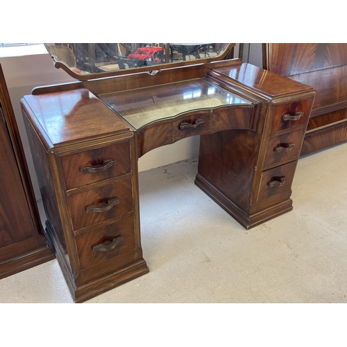 1429 - A vintage 1940's walnut veneer 4 piece bedroom suite with shaped handles of channelled design. 2 doo... 