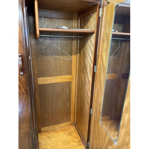 1429 - A vintage 1940's walnut veneer 4 piece bedroom suite with shaped handles of channelled design. 2 doo... 