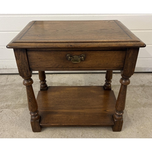 1431 - A vintage dark oak Simon Simpson, Norwich (Mark Chambers) side/occasional table with central drawer ... 