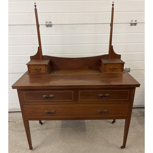 1433 - An Edwardian satin wood dressing table with inlaid detial and tapered legs raised on ceramic caster ... 