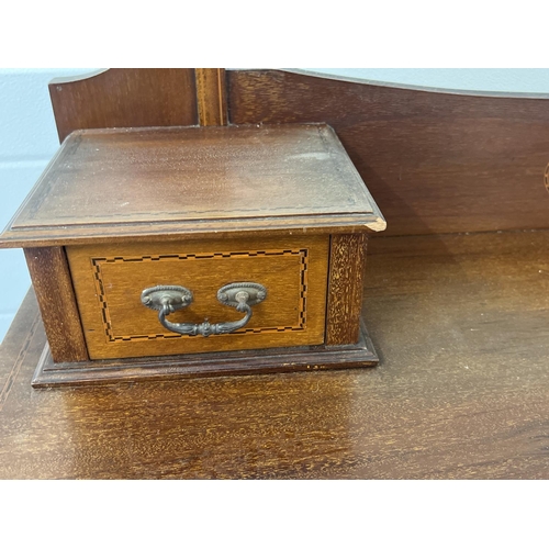 1433 - An Edwardian satin wood dressing table with inlaid detial and tapered legs raised on ceramic caster ... 