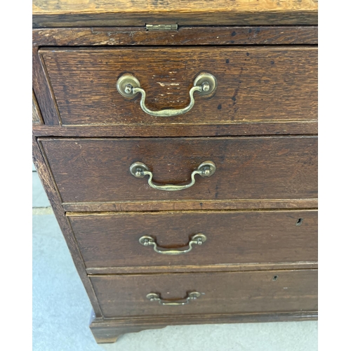 1437 - An antique walnut 4 drawer bureau with internal stationery compartments and brass drop down handles.... 