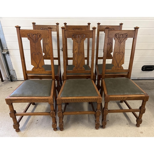 1438 - A set of 6 Art Nouveau dark oak dining chairs with turned legs and stylised carved backs. Turned fro... 